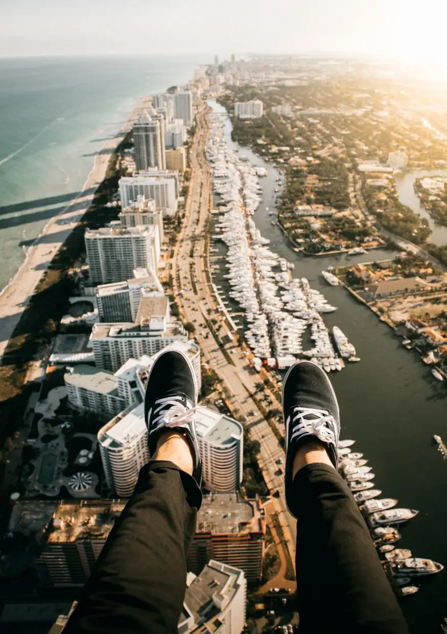 Customer enjoying a thrilling doors-off helicopter ride over Miami’s South Beach and skyline.