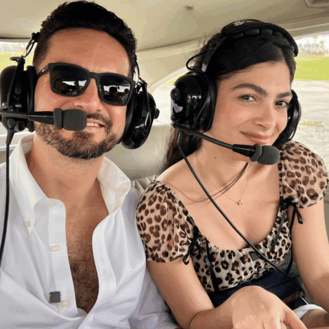 Couple celebrating a special date on a private helicopter tour over Miami with Magic Air Tours