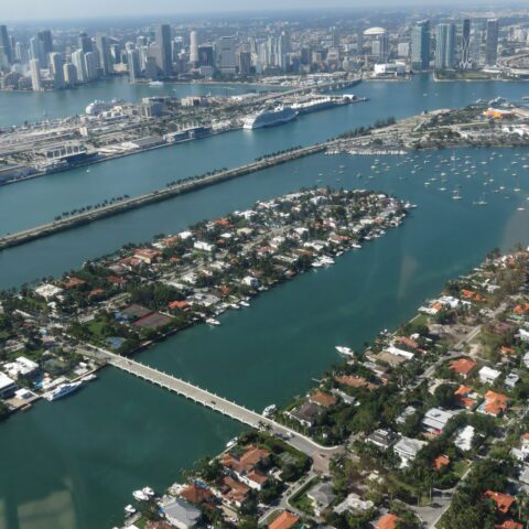 Magic Air Tours airplane flying over Star Island and Biscayne Bay on a private Miami sightseeing tour