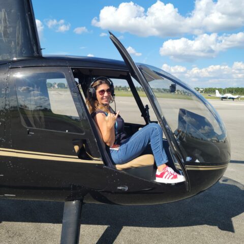 Happy customer at Magic Air Tours helicopter after a scenic flight over Miami