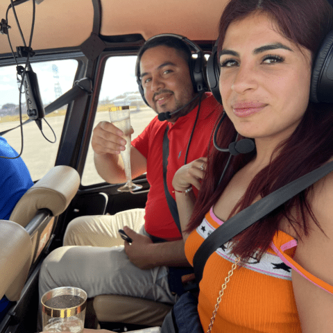 Couple enjoying a private romantic helicopter flight over Miami with Magic Air Tours