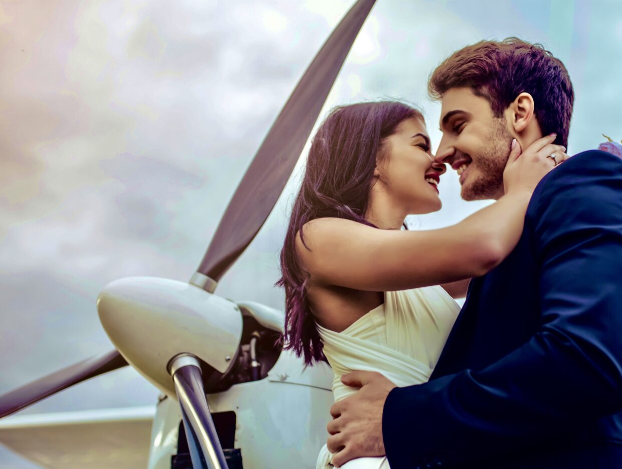 Couple celebrating a marriage proposal on a helicopter flight over Miami with Magic Air Tours.