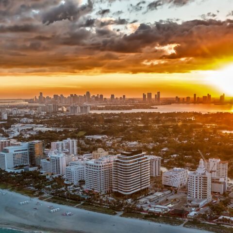 Sunset aerial view of Miami skyline and coastline from a Magic Air Tours helicopter